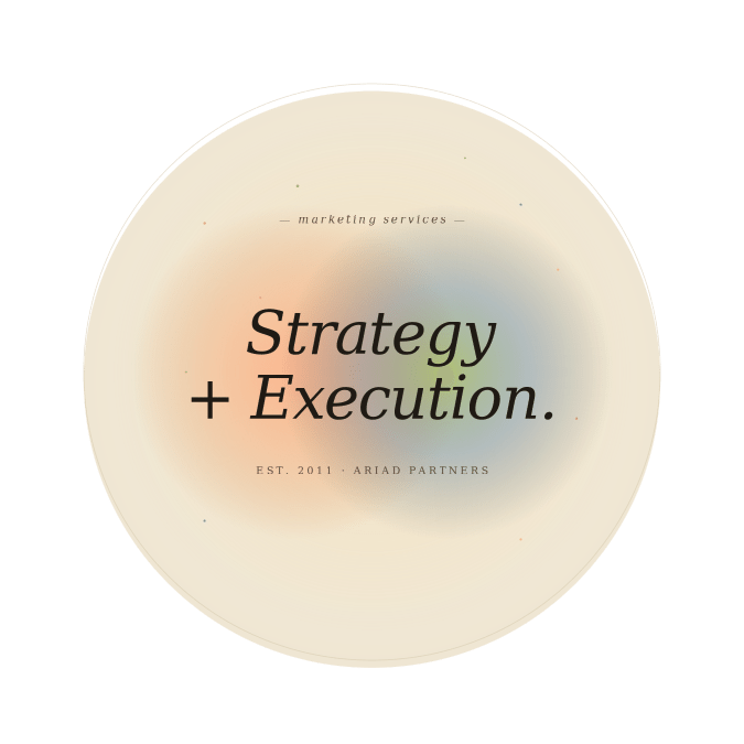 marketing-services-hub-page-image-675 (1) Editorial typography graphic with the phrase "Strategy + Execution." in large italic serif type with two intersecting gradient orbs, representing Ariad Partners' integrated marketing services.